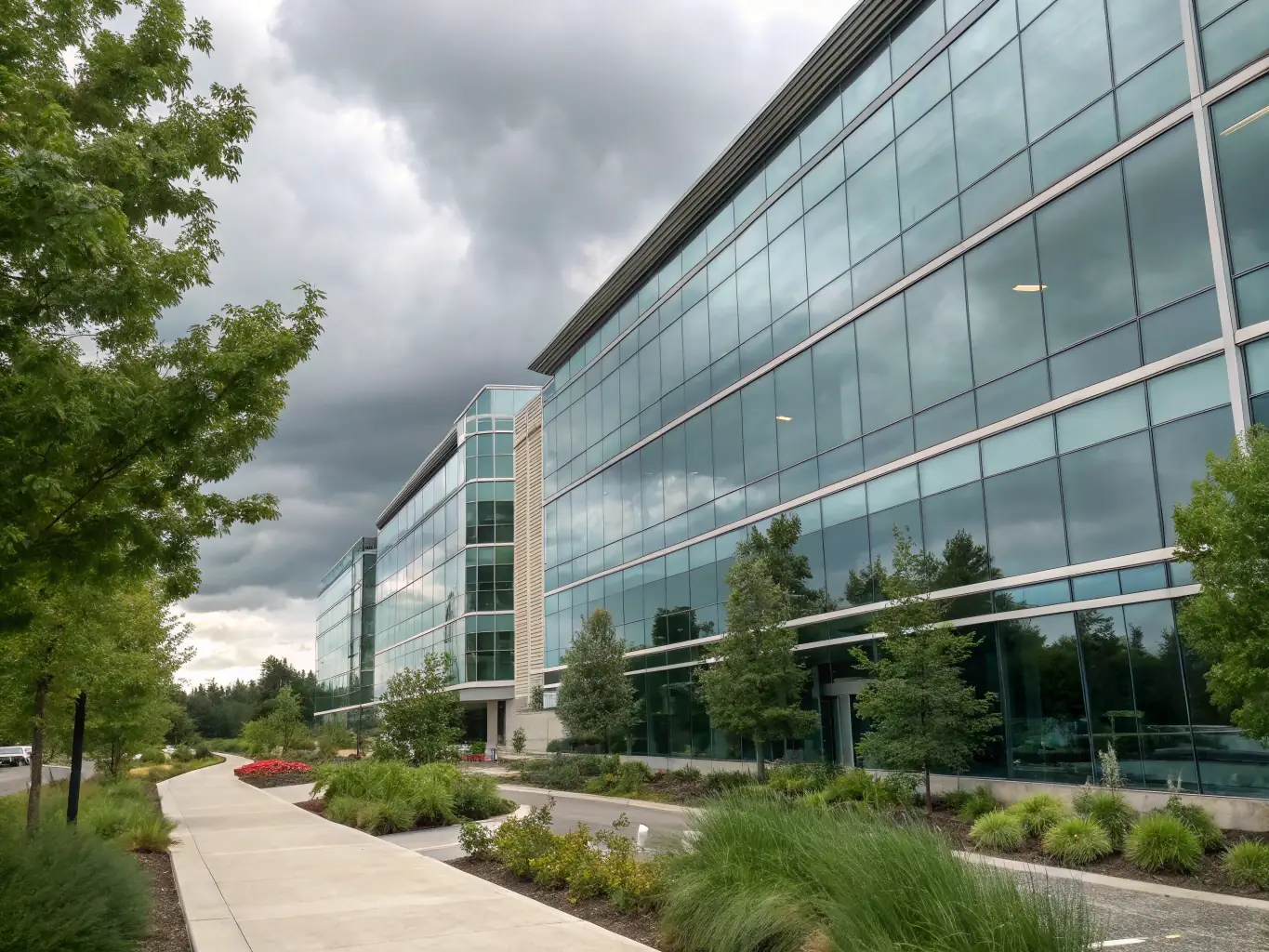 A modern office building exterior with glass facade, showcasing a connected and efficient workspace, symbolizing Atlanta Fiber Optic's solutions for office buildings.